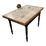 Solid wood table with newspaper pattern