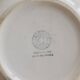Vintage salad bowl in ivory faience from Chantilly with a rainbow trim.