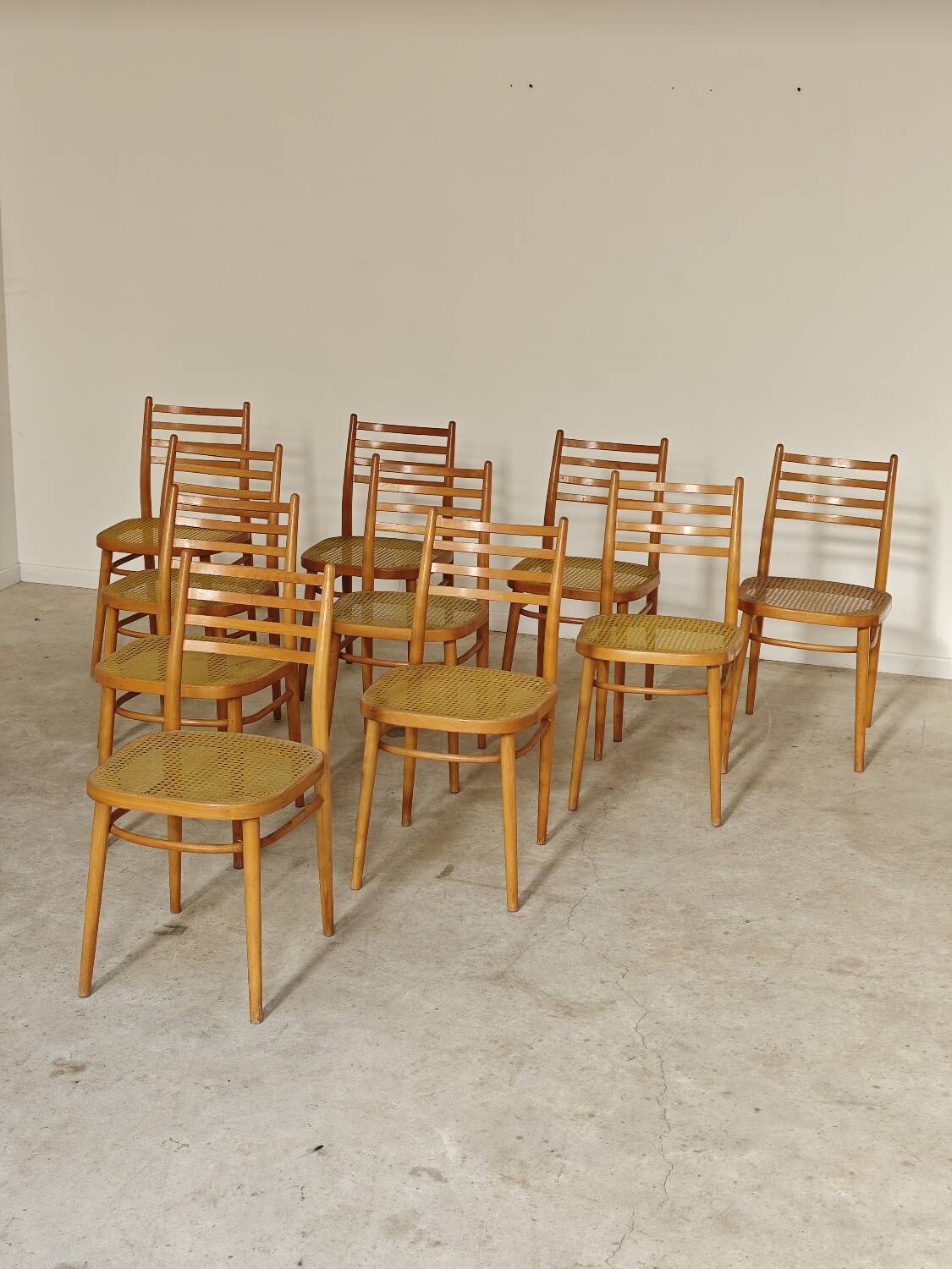 Set of 10 Bystrice tone wooden and caned chairs from the 1960s.