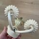 Vintage wrought iron wall sconce in the shape of a flower/leaf