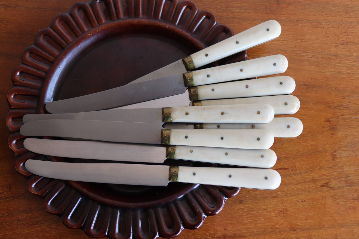 Set of 9 vintage cream table knives
