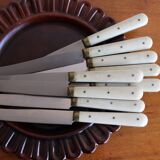 Set of 9 vintage cream table knives