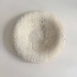 Travertine donut-shaped pocket emptier