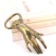 Brass hand bottle opener, 50s