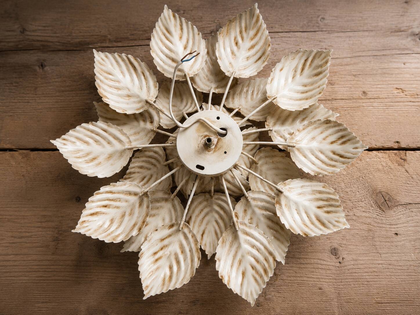 Flower applique attributed to Masca, 52cm in diameter.