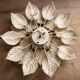 Flower applique attributed to Masca, 52cm in diameter.