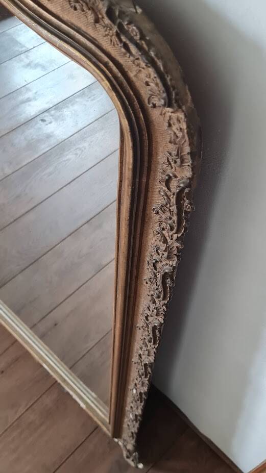 Antique Louis Philippe mirror with a pediment.