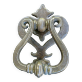 Impressive door knocker from the High Middle Ages in solid bronze.