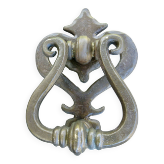 Impressive door knocker from the High Middle Ages in solid bronze.