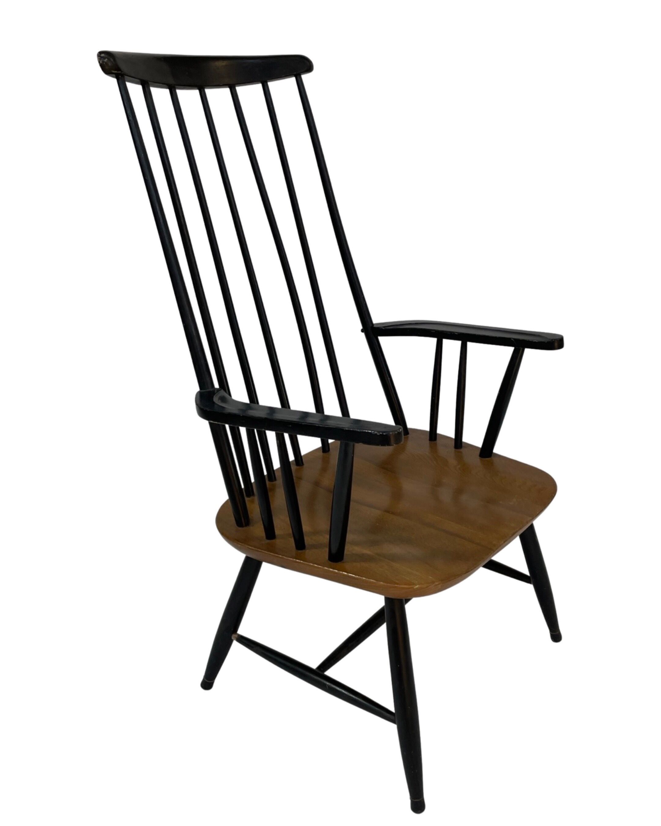 Vintage easy chair with high back and armrest from the 60s