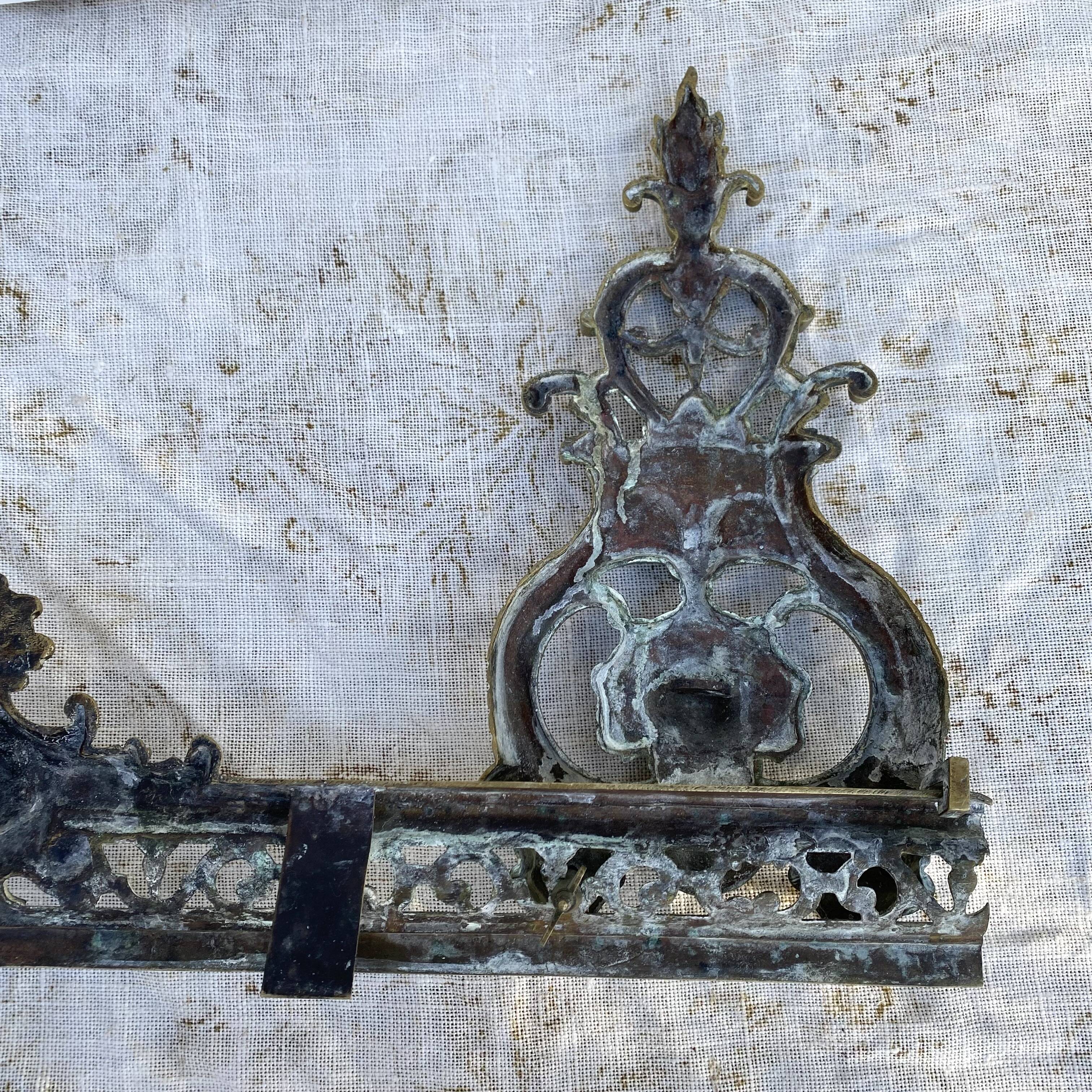 Antique brass fireplace set, bar and andirons, Napoleon I style.