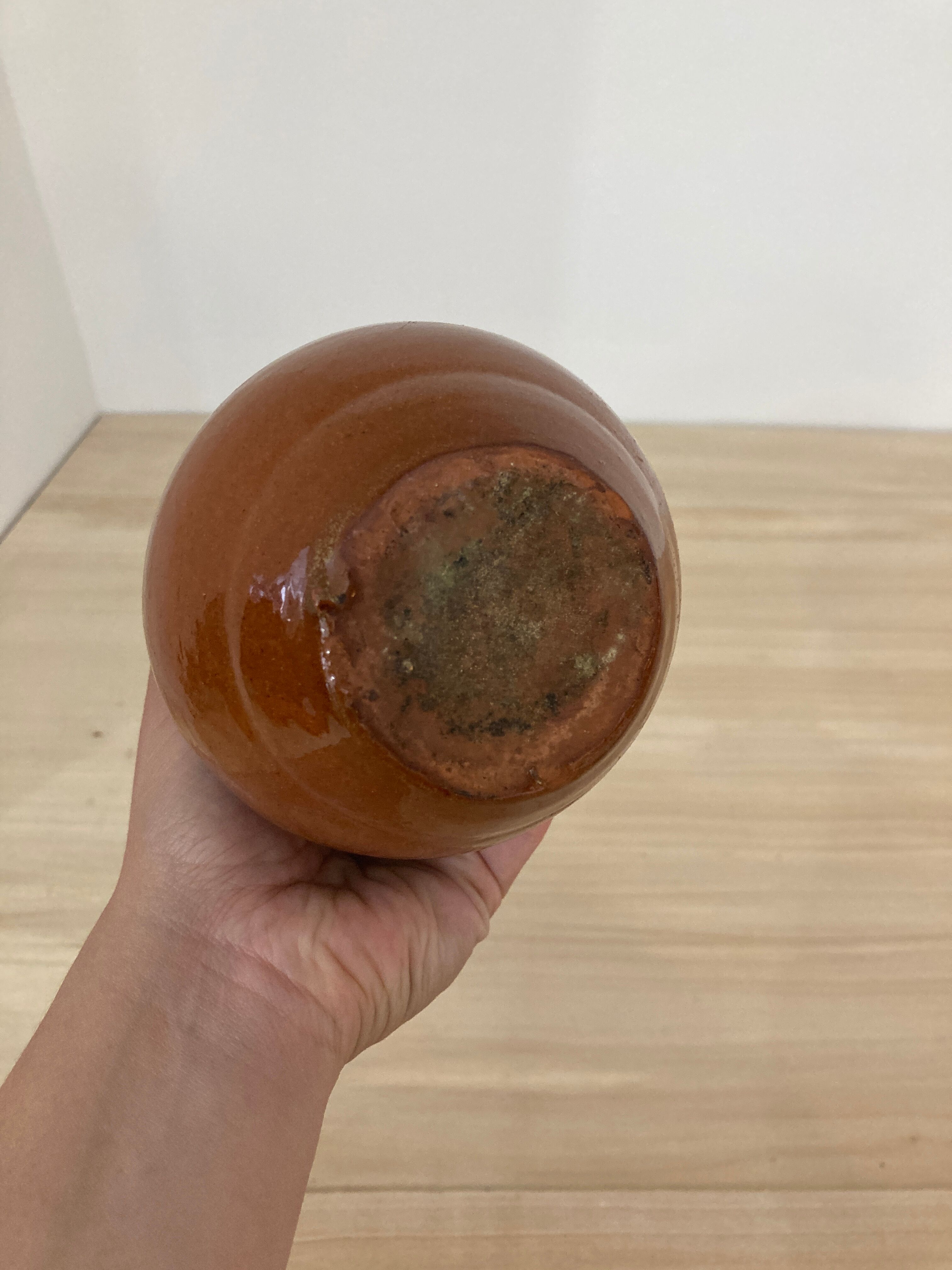 Green and brown ceramic pitcher