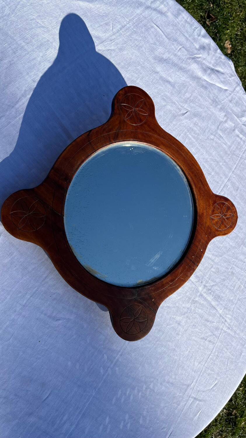Wooden mirror with vintage rosettes