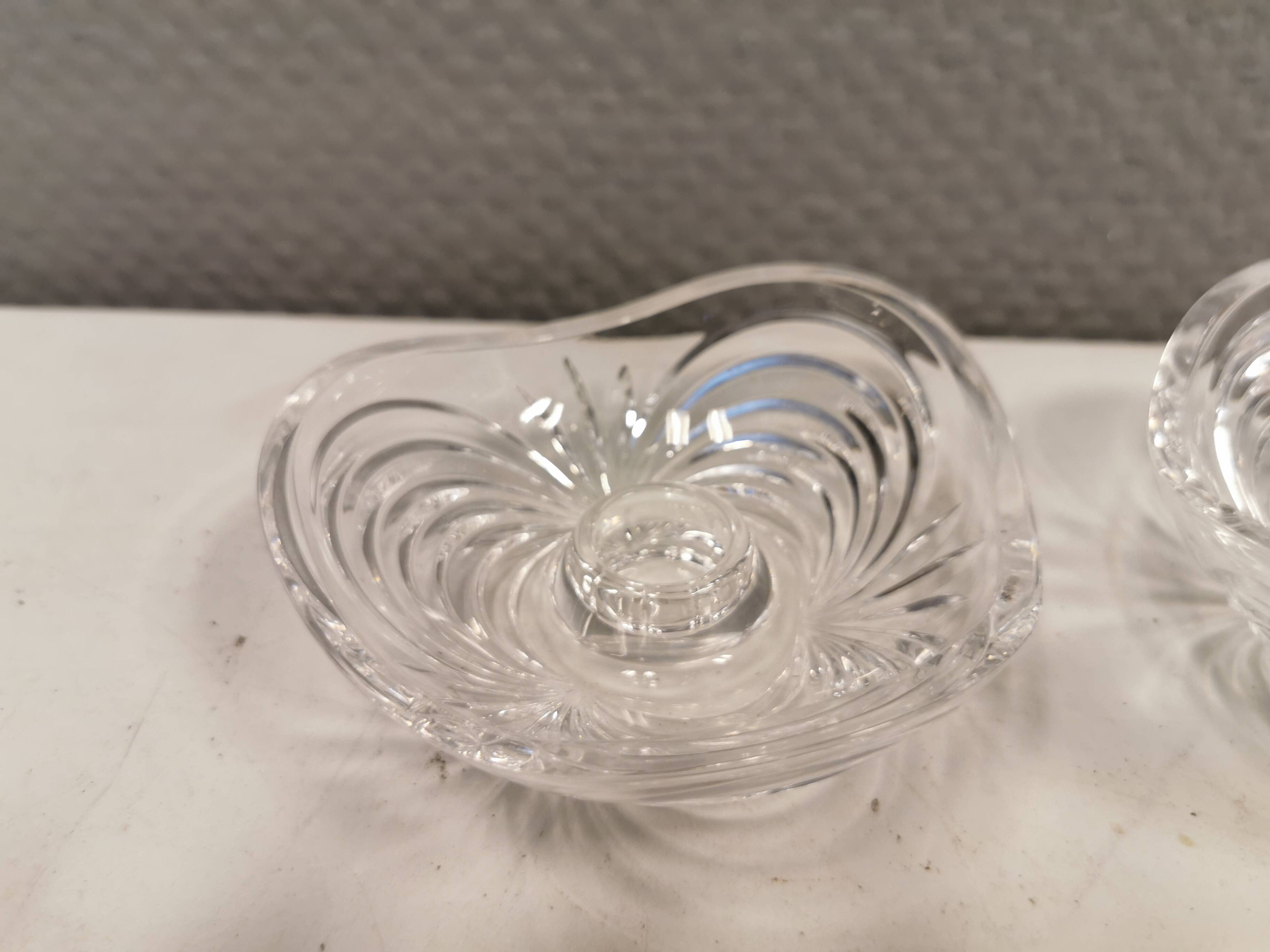 A set of beautiful rock crystal glass candle holders from Swedish Orrefors. Estimated 1970s.