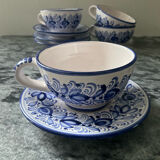 Set of 4 white/blue ceramic cups and saucers.