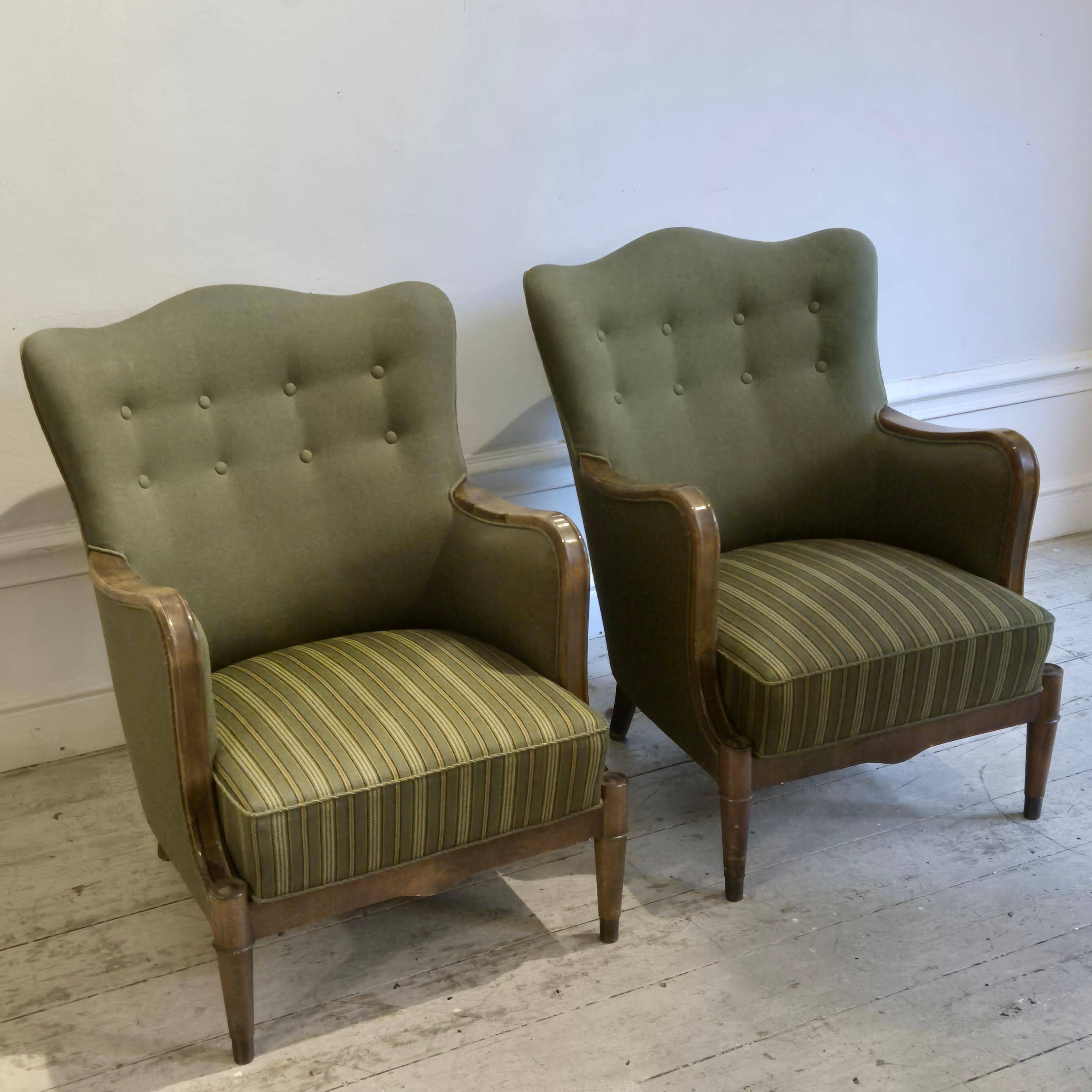 Modern Danish armchairs by Alfred Christensen. Beautiful shape, brass legs.