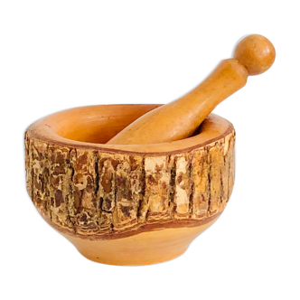 Vintage mortar and pestle made of natural wood