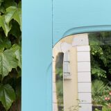 Beveled mirror on turquoise Parisian door