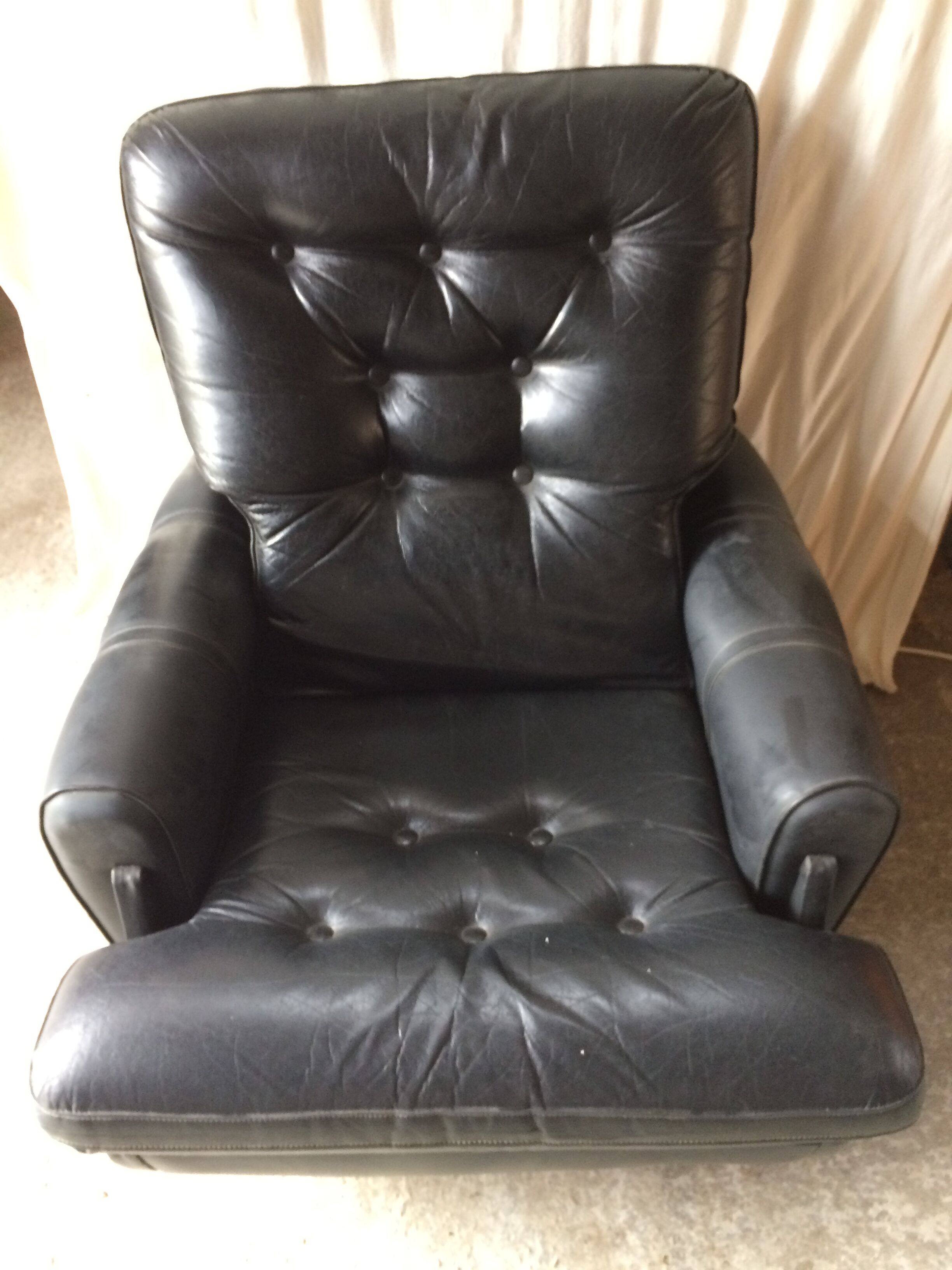 Former black leather chair