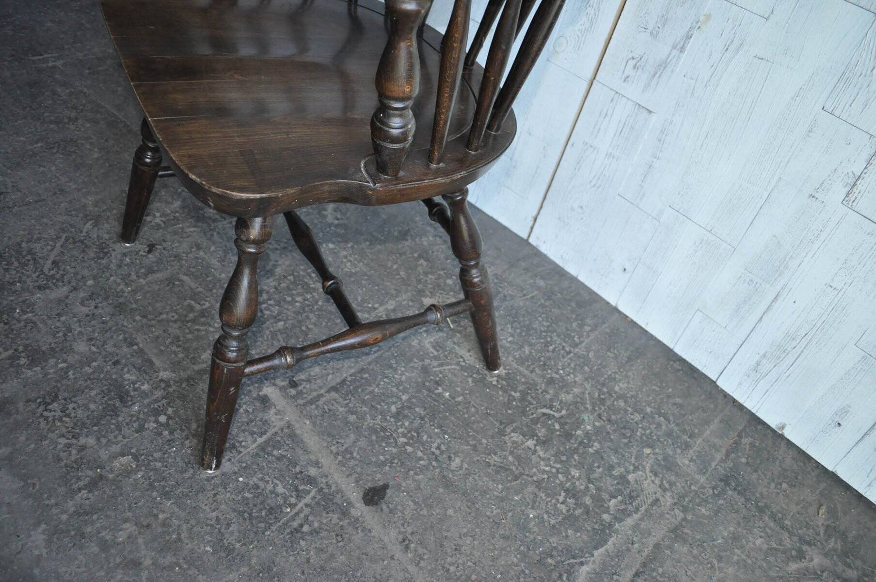 Brown wooden Windsor chair, 19th century — slatted backrest and carved seat