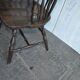 Brown wooden Windsor chair, 19th century — slatted backrest and carved seat