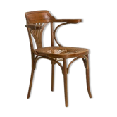 Bistro chair with curved wooden armrests and canning seat