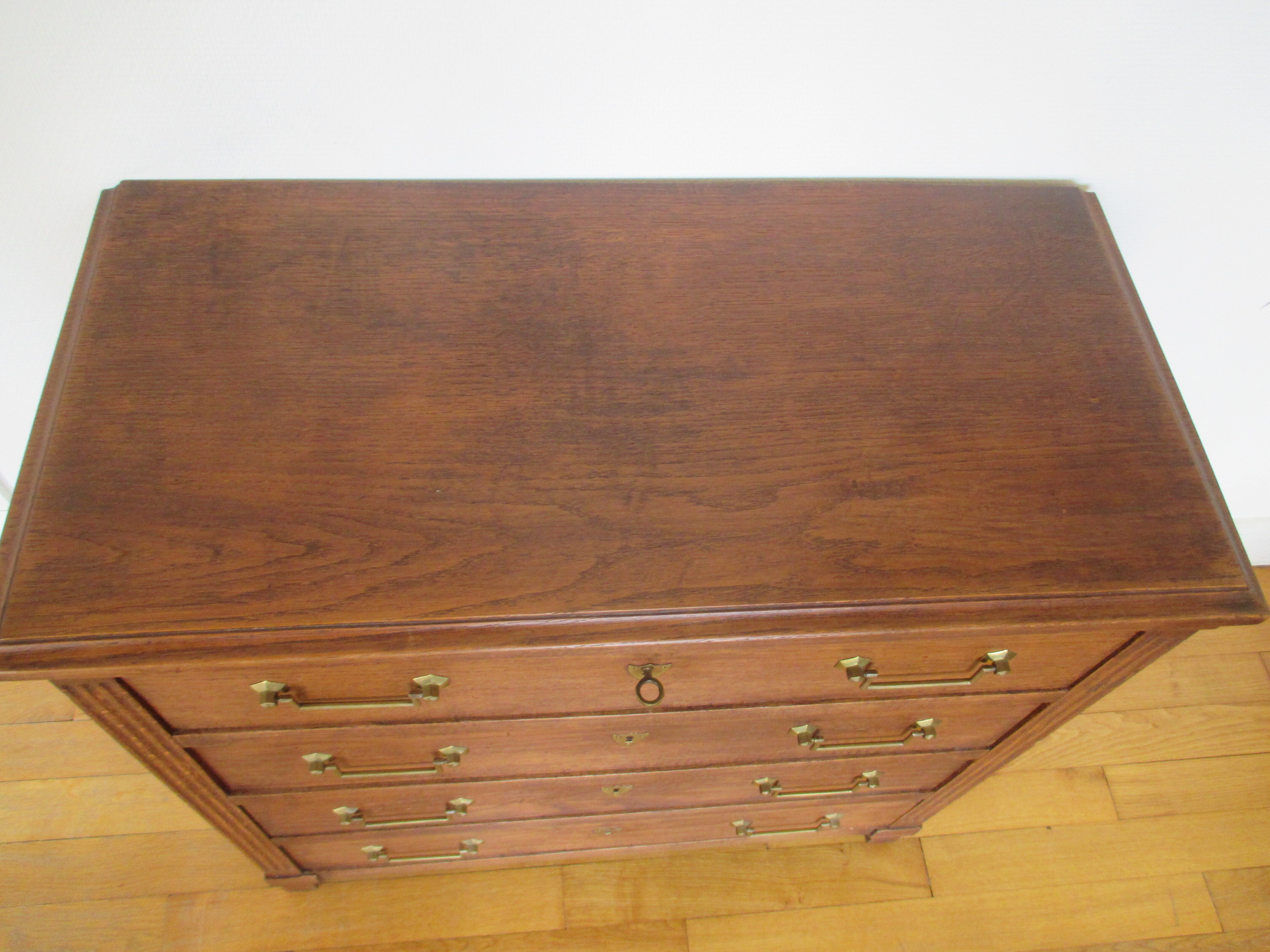 Oak chest of drawers and brass handles