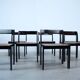 Set of eight black lacquered dining chairs
