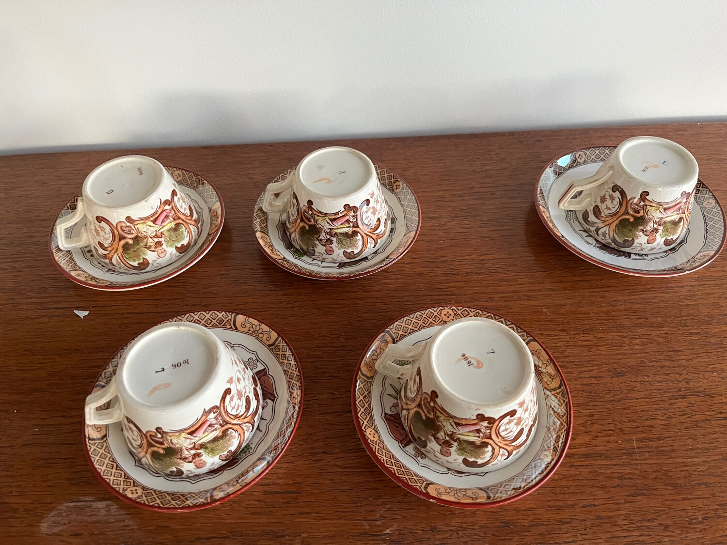 Set of 5 Sarreguemines Chinese Cups and Saucers.
