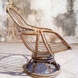 Antique swivel rattan armchair