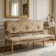 Louis XV style canapé in carved natural wood and floral upholstery.