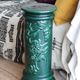 Pedestal column in green ceramic with flower and fruit decoration