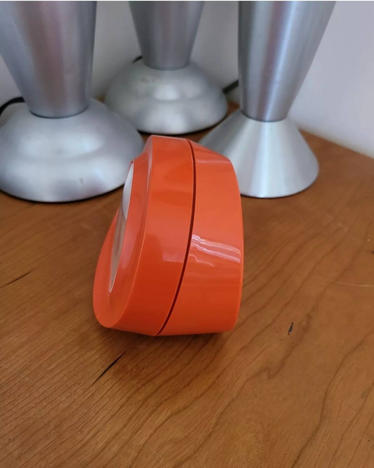 Vintage mechanical alarm clock in orange plastic Uti West Germany