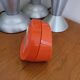 Vintage mechanical alarm clock in orange plastic Uti West Germany