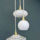 Vintage white glass triple globe suspension from Clichy and opaline.