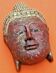 Masque à suspendre visage de bouddha bois polychrome sculpté