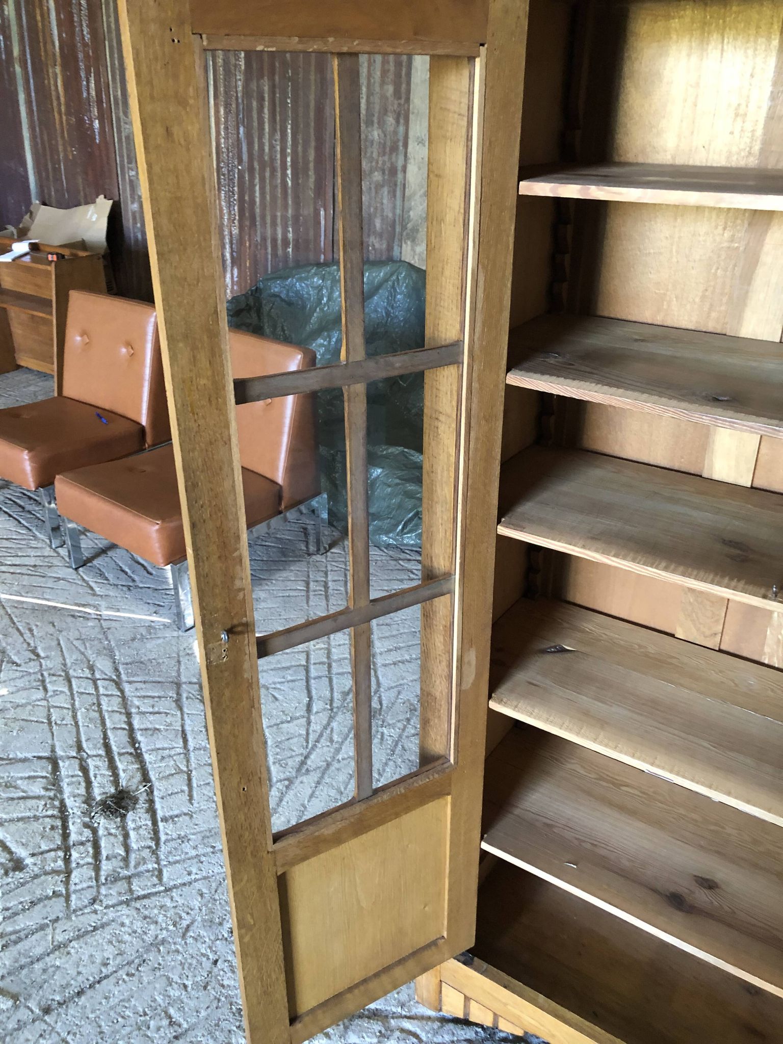 Vintage oak bookcase from the reconstruction period with 2 doors with small panes.