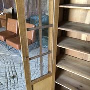 Vintage oak bookcase from the reconstruction period with 2 doors with small panes.