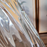 Vintage thick glass vase with twisted ribbed relief.