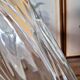 Vintage thick glass vase with twisted ribbed relief.