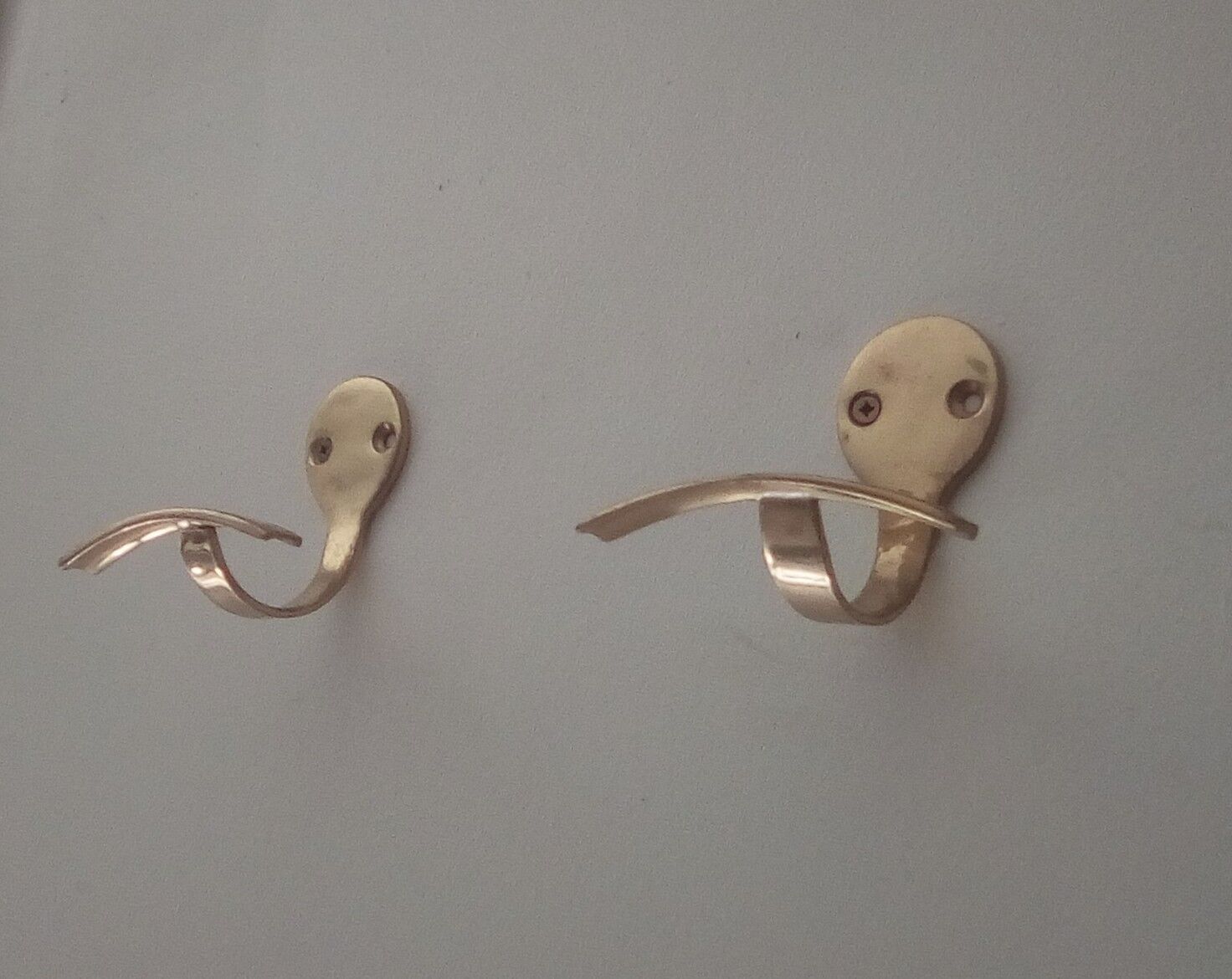 Pair of coat racks in gilded steel 70s/80s