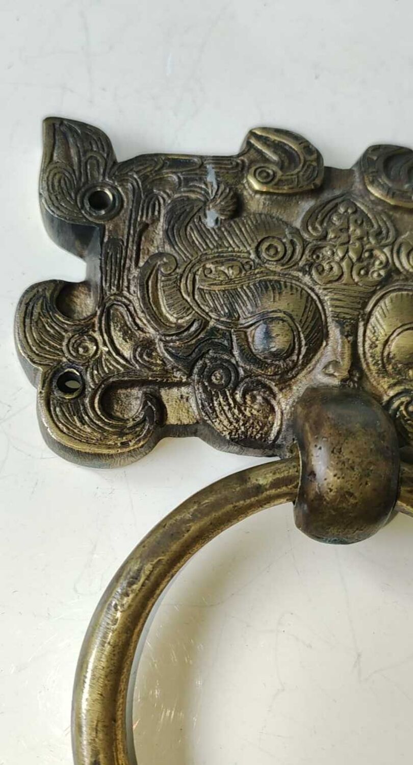 Ancient door knocker, taotié mask, shang dynasty. in bronze golden patina