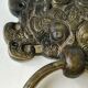 Ancient door knocker, taotié mask, shang dynasty. in bronze golden patina