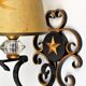 1950 gold star and black metal sconces