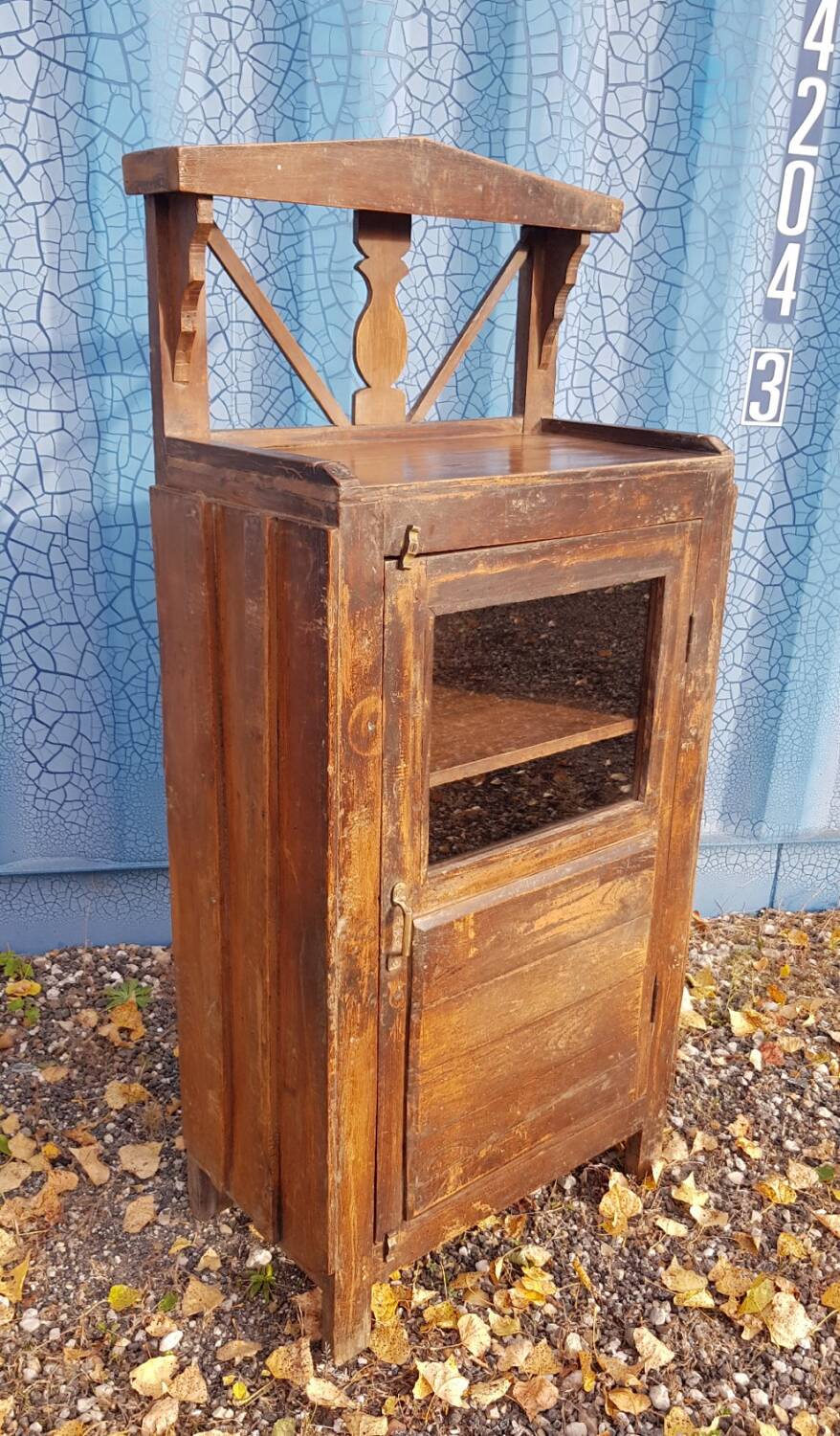 Glass side table in Burmese teak