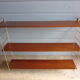 Wall shelves in brass and teak of the 1960s