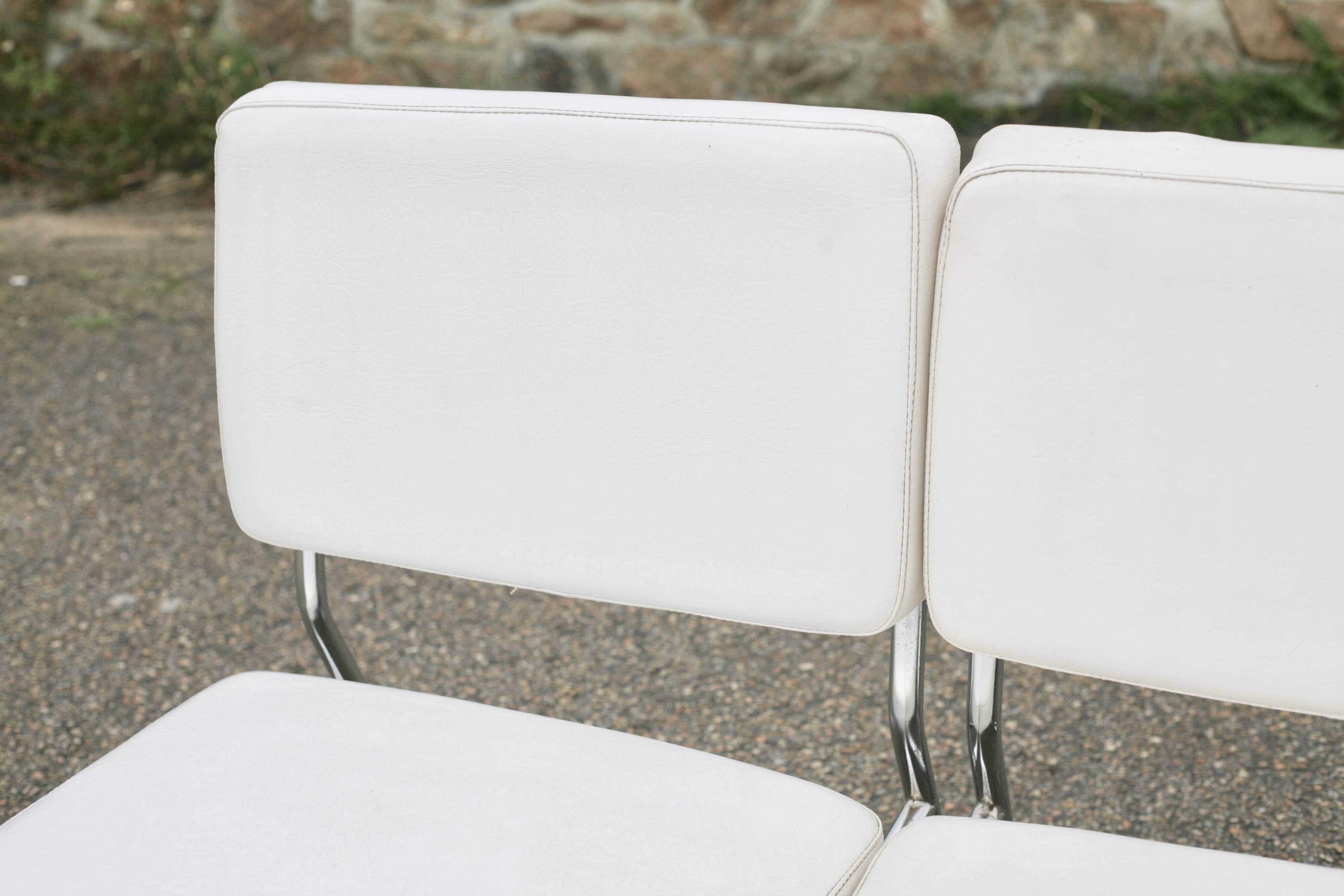 4 armchairs forming a modular sofa. Steel, imitation leather, 70s