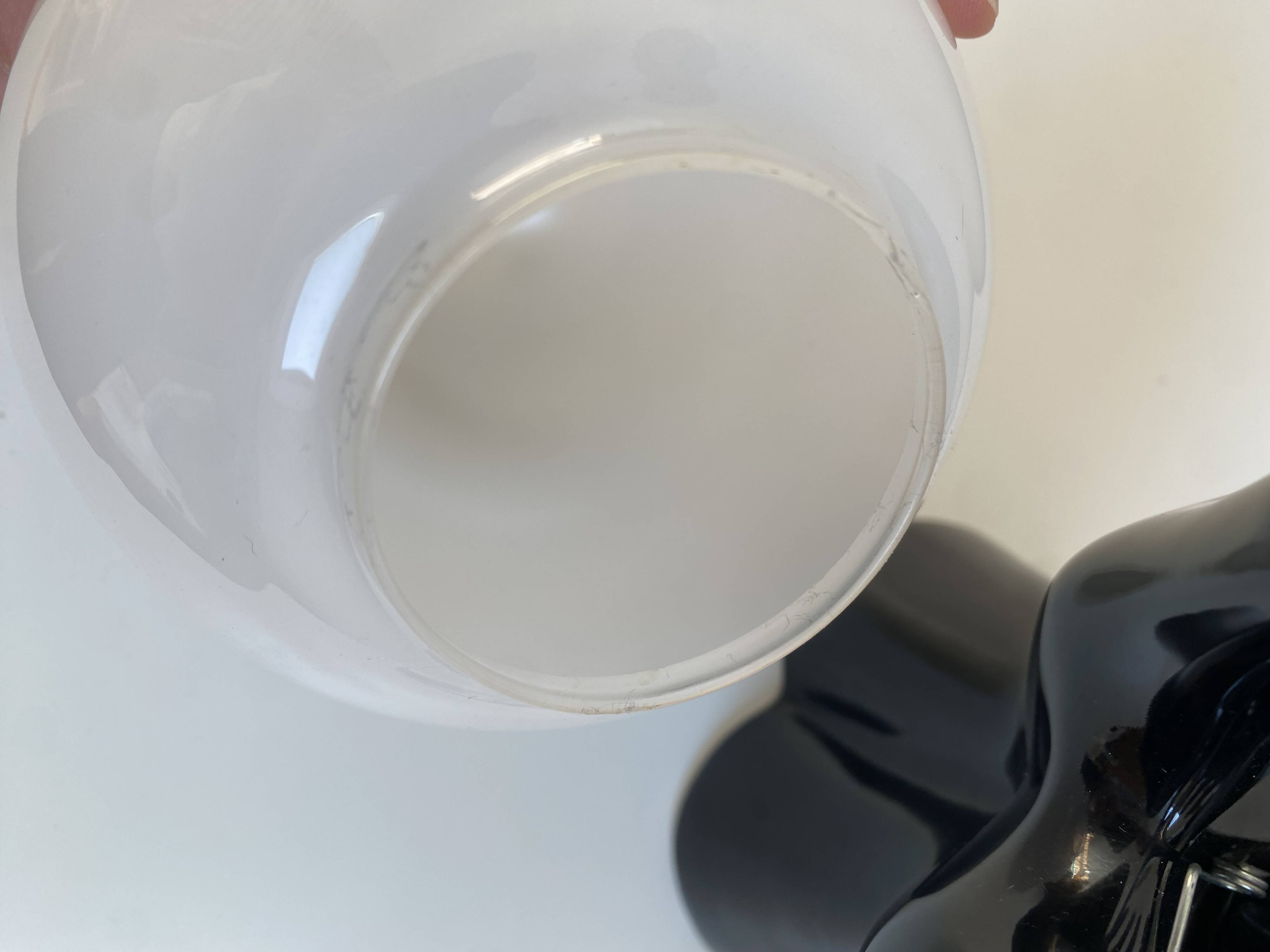 Sculpted ceramic globe lamp.