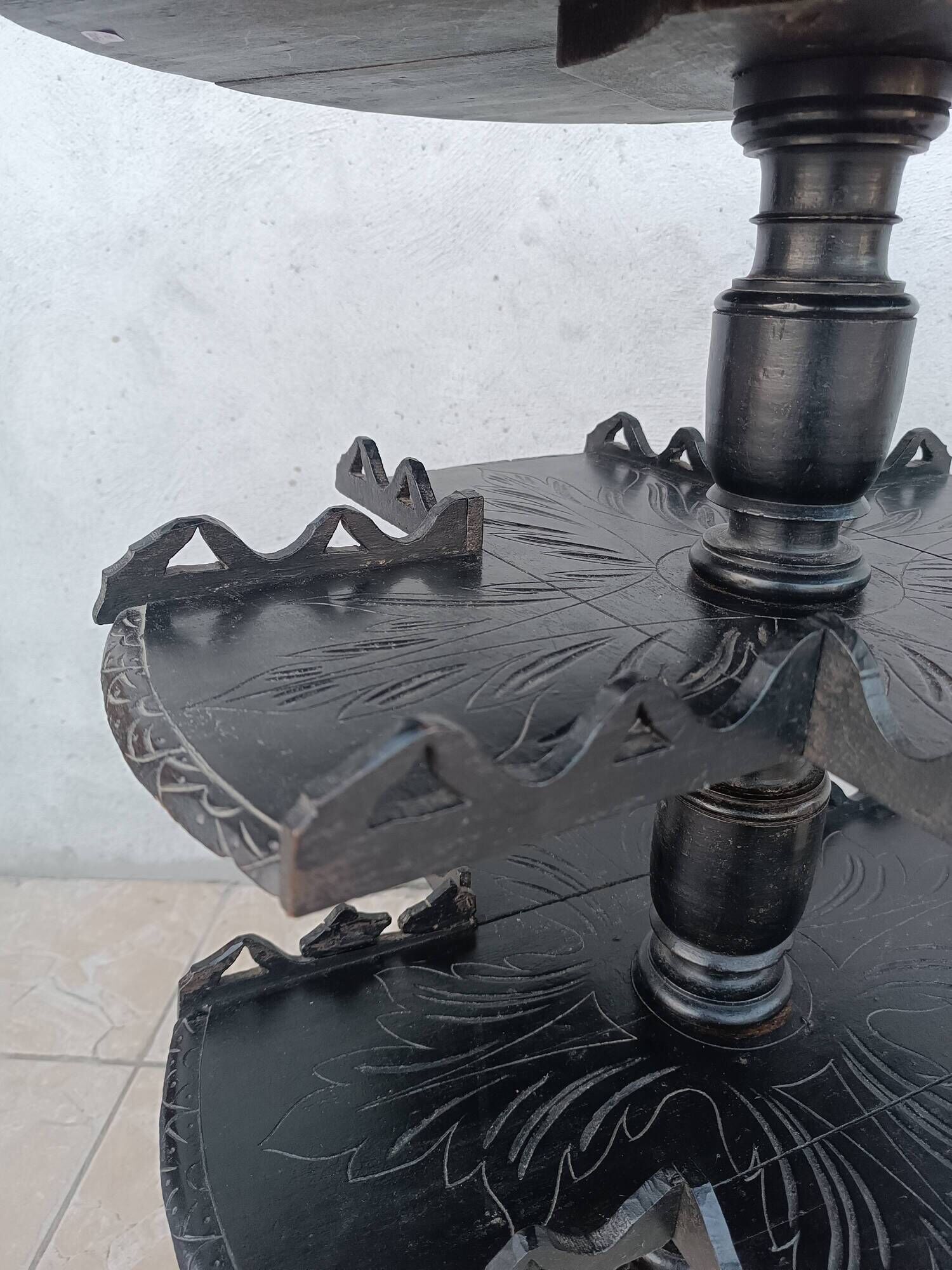 Napoleon III period gueridon in blackened wood.