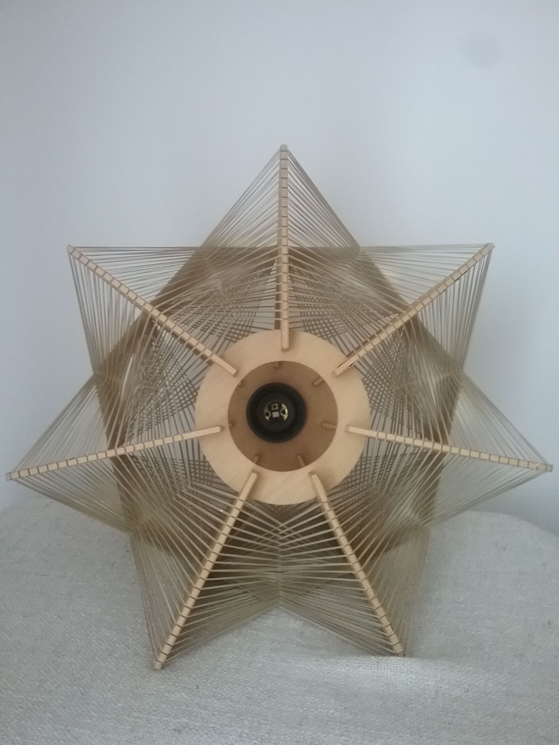 Hanging lamp of wood and thread Scandinavian style